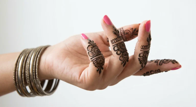 Traditional finger mehndi design with elegant floral henna patterns